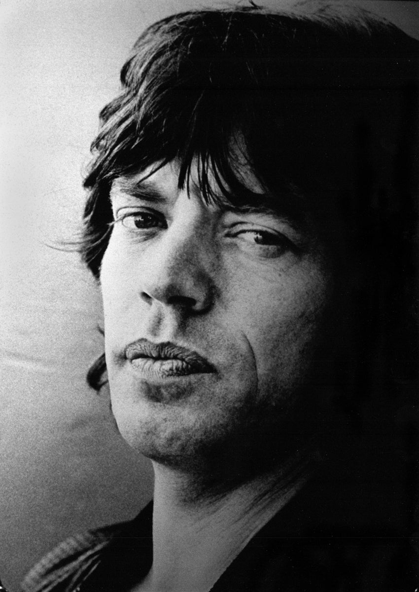 Mick Jagger in a tightly framed black-and-white portrait in 1975. Photograph by Gijsbert Hanekroot.