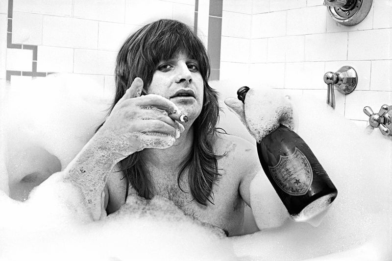 Ozzy Osbourne photographed in a bathtub at The Plaza Hotel, New York City, 1981, by Mark Weiss.