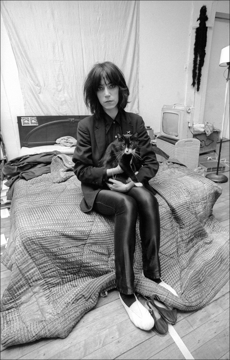 Patti Smith at home, New York City, 1974, photographed by Allan Tannenbaum.