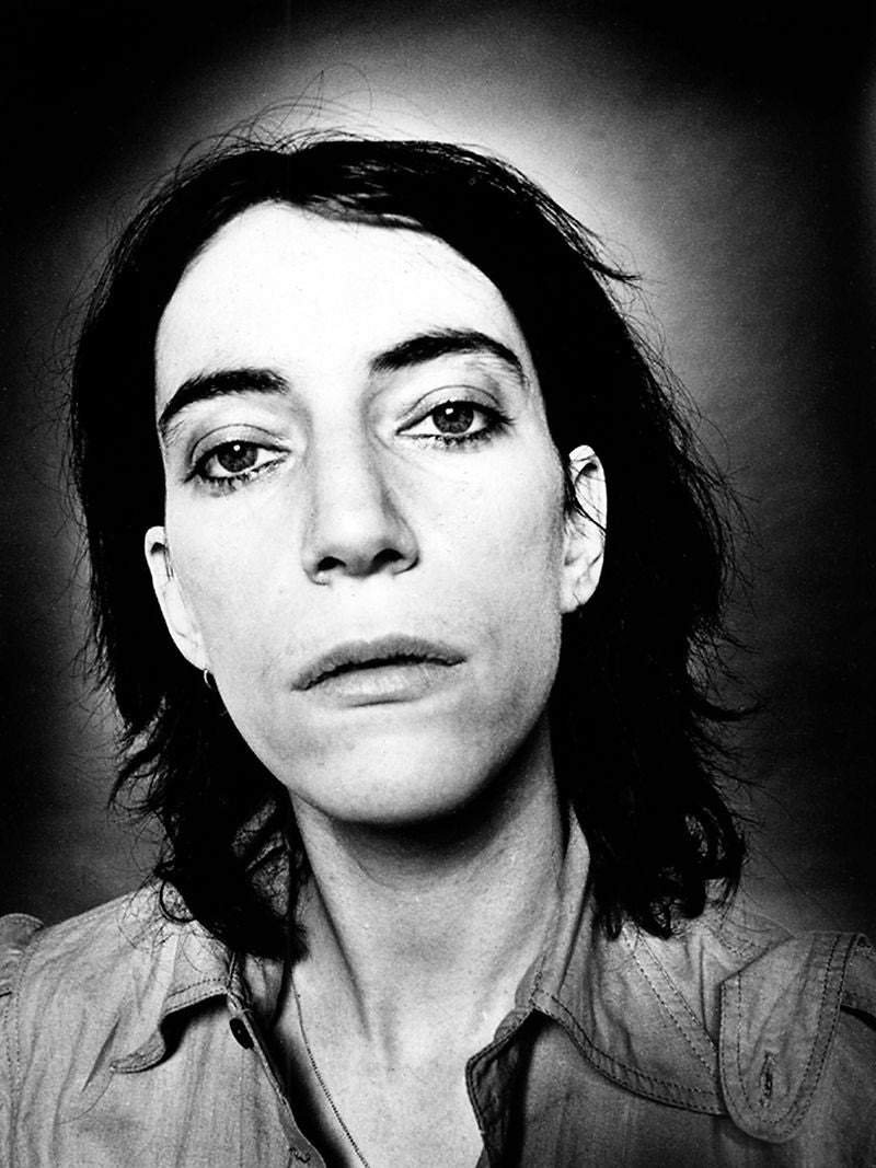 Patti Smith looking directly into the camera in a close-up portrait in 1976. Photograph by Gijsbert Hanekroot.