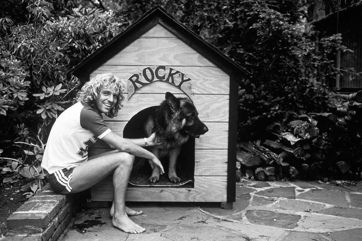 Peter Frampton at home with his dog Rocky, New York, 1979, photographed by Mark Weiss.