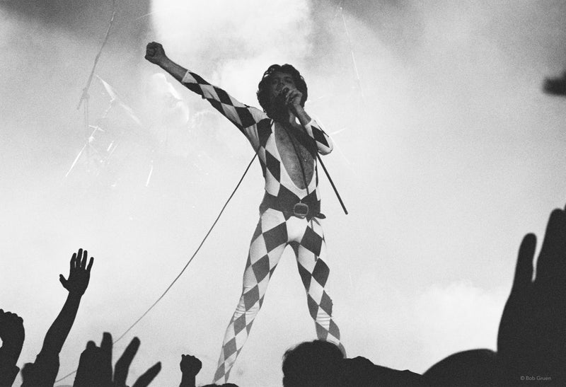Freddie Mercury of Queen in harlequin costume on stage at Madison Square Garden, New York City, December 1977, photographed by Bob Gruen.