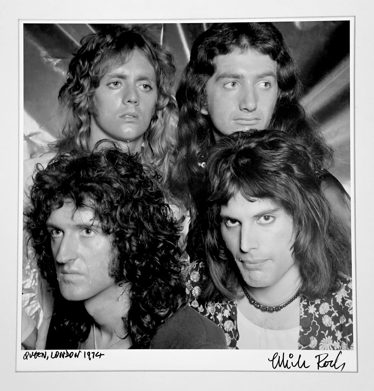 Queen — Freddie Mercury, Brian May, Roger Taylor and John Deacon — portrait in London, 1974, by Mick Rock. A signed, hand-titled late print.