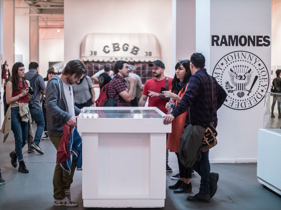 Visitors viewing the exhibition "Ramones & CBGB: The Punk Years" presented by The Music Photo Gallery at Centro Cultural Borges, Buenos Aires, Argentina, 2018.