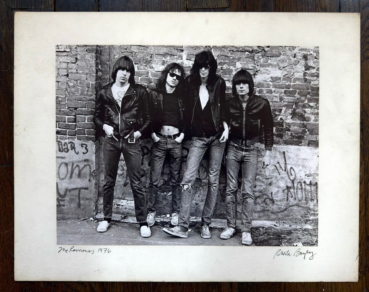 The Ramones in New York City, 1976, photographed by Roberta Bayley; original vintage gelatin silver print, signed and mounted with a white margin.