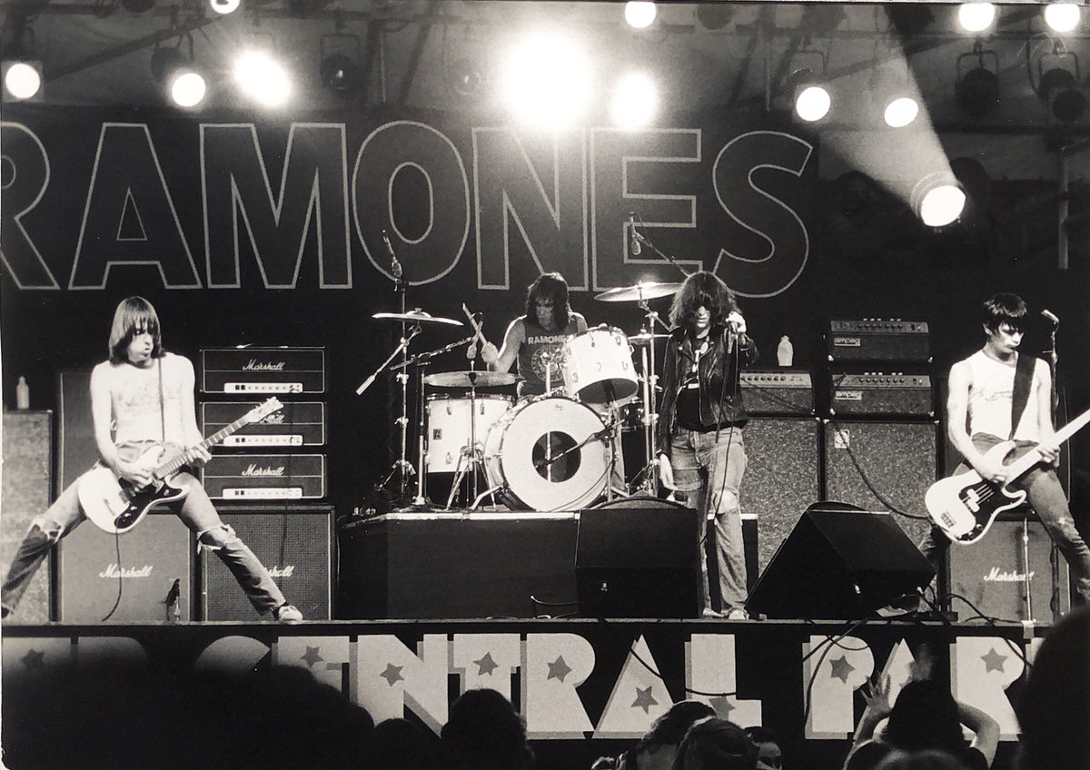 Ramones performing at Wollman Rink in Central Park, New York City, August 6, 1979, photographed by Bob Gruen. Vintage gelatin silver print.