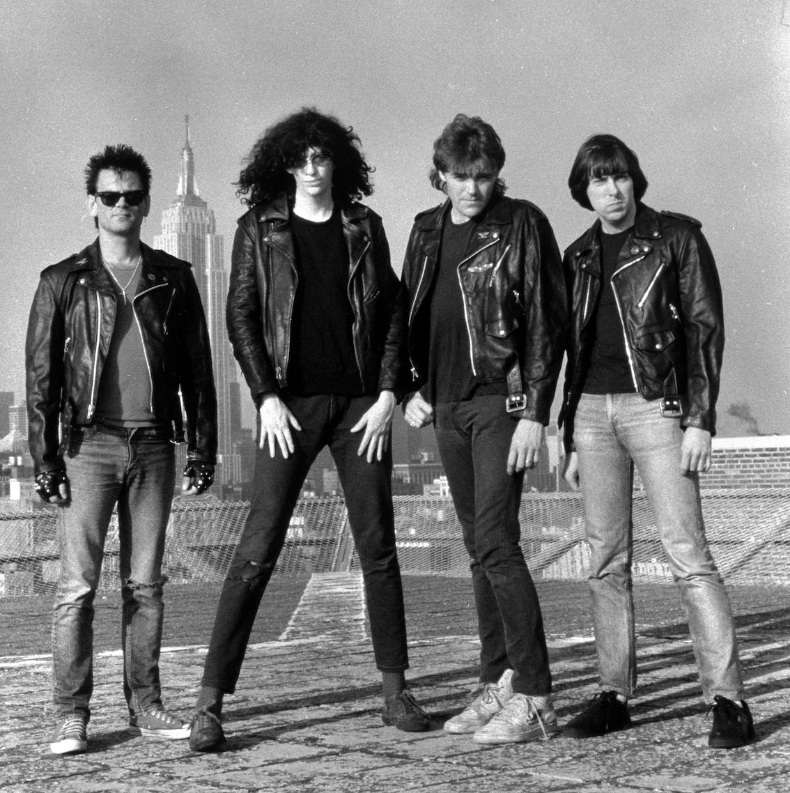 Ramones on a rooftop with the Manhattan skyline, New York City, 1984, photographed by George DuBose.