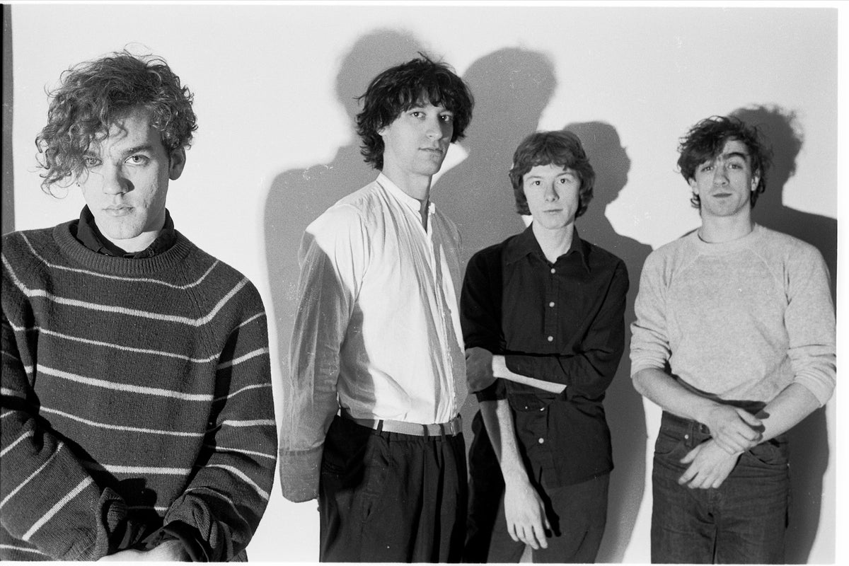 R.E.M., studio group portrait, photographed by George DuBose.