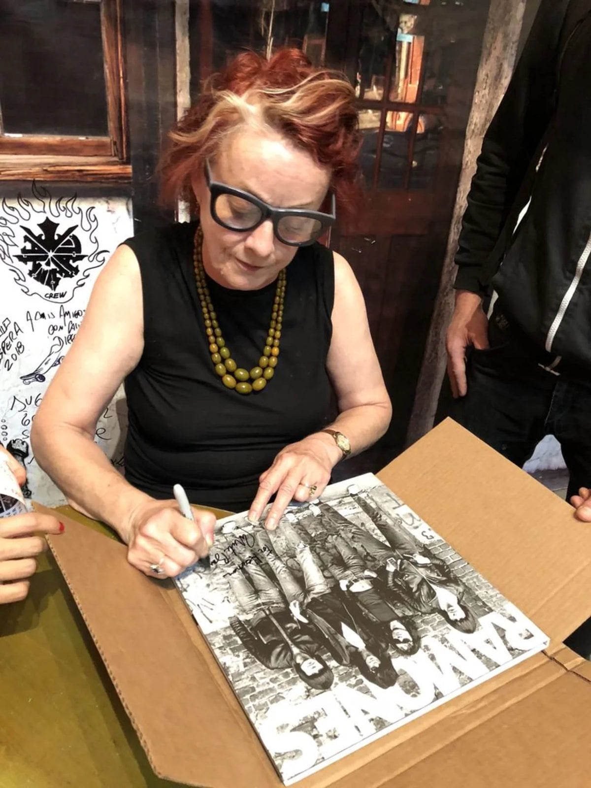 Roberta signing catalogs at the Exhibition in Buenos Aires, Argentina, 2018