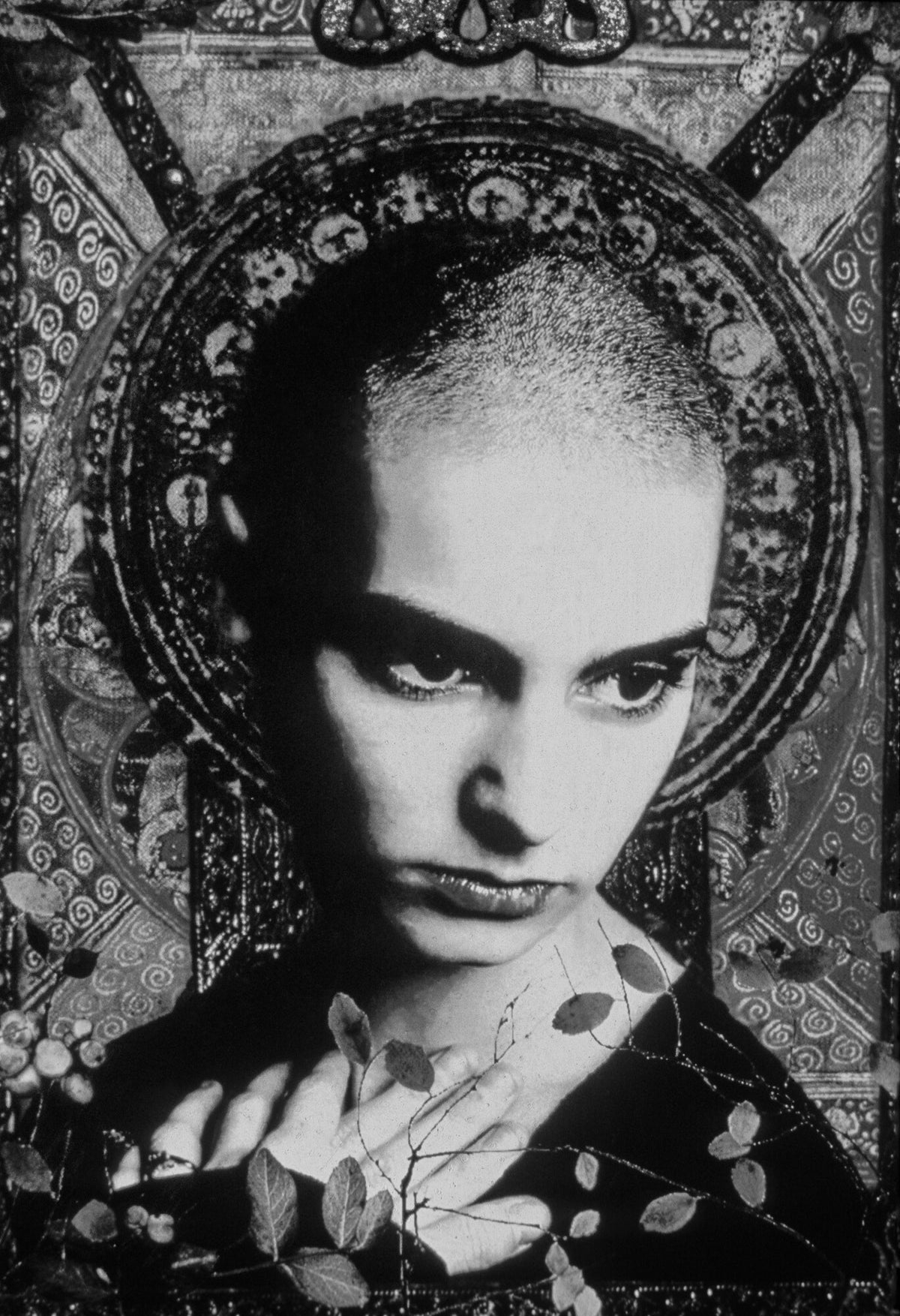 Sinéad O'Connor framed by an ornate pattern, in black and white, 1993, photographed by Lynn Goldsmith.