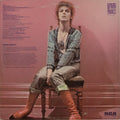 David Bowie on the back cover of the 1972 RCA edition of Space Oddity, photographed by Mick Rock in Zowie’s room at Haddon Hall.