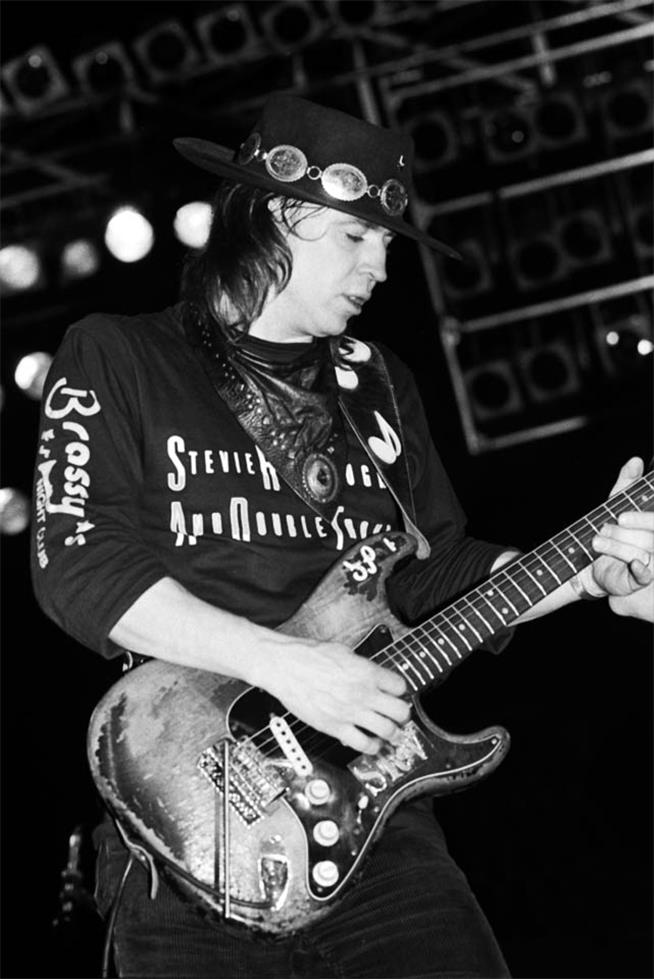 Stevie Ray Vaughan playing his Stratocaster on stage, photographed by Charlyn Zlotnik, 1989.