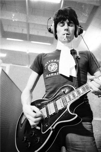Keith Richards playing guitar at Olympic Studios, London, photographed by Michael Cooper, 1966.