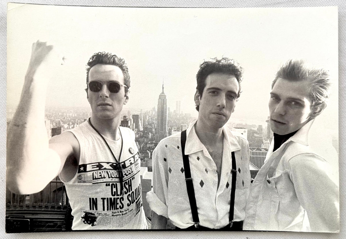 Original vintage gelatin silver print of The Clash atop Rockefeller Center with the New York City skyline, 1981, photographed by Bob Gruen.