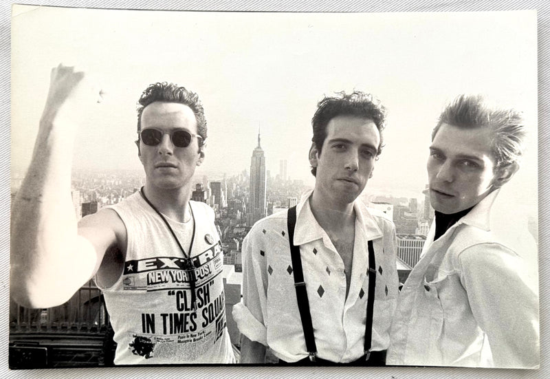 Original vintage gelatin silver print of The Clash atop Rockefeller Center with the New York City skyline, 1981, photographed by Bob Gruen.