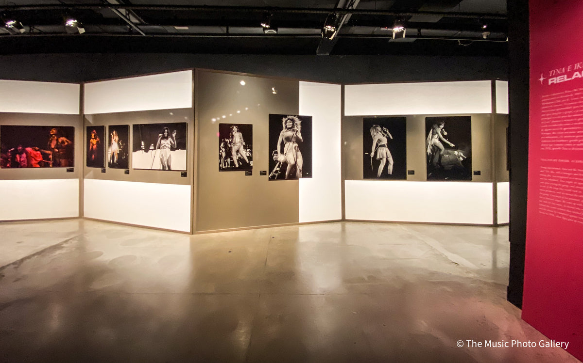 Photographs of Tina Turner in performance on illuminated display walls in Tina Turner: A Journey to the Future at the Museum of Image and Sound (MIS), São Paulo, Brazil.