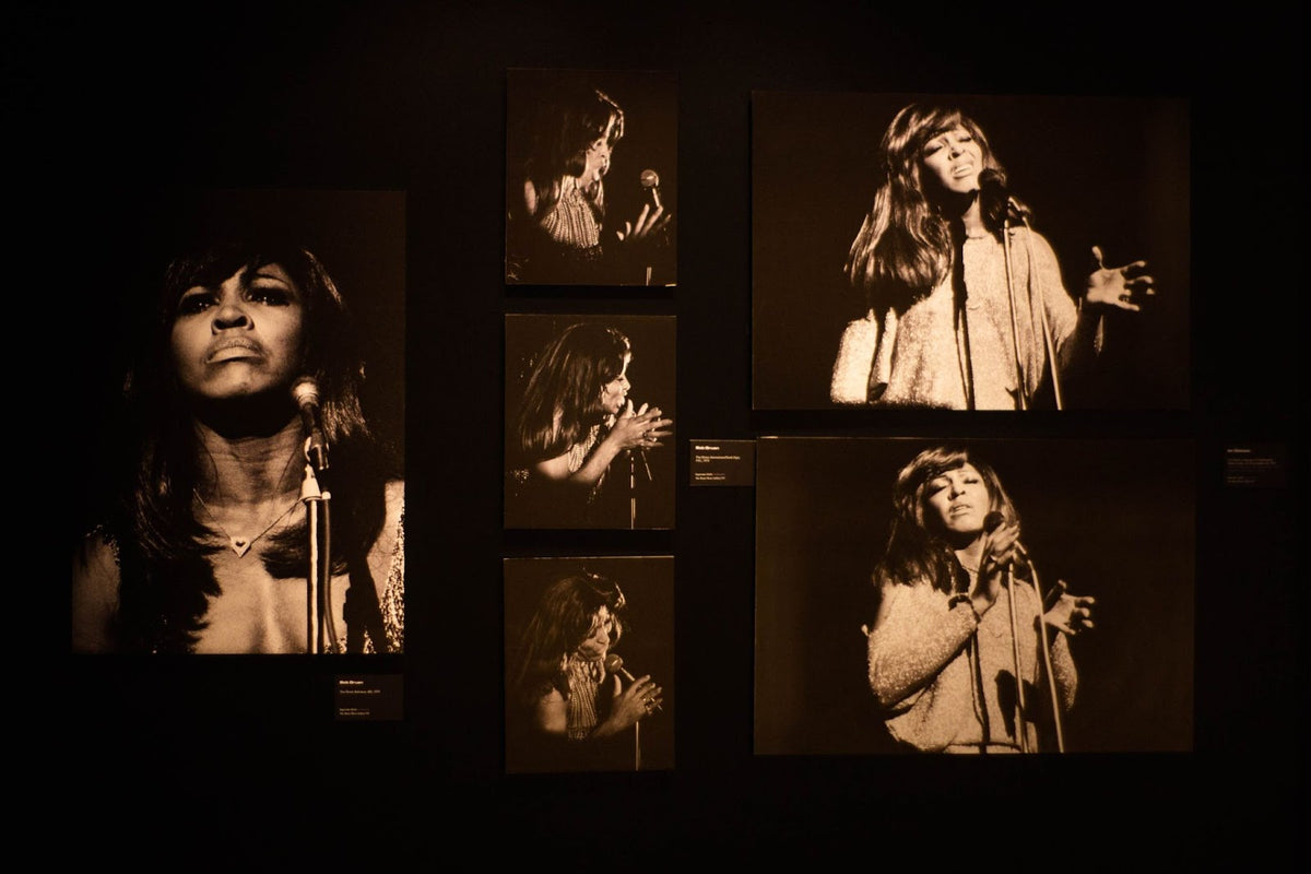 A wall of warm-toned photographs of Tina Turner in performance in Tina Turner: A Journey to the Future at the Museum of Image and Sound (MIS), São Paulo, Brazil.