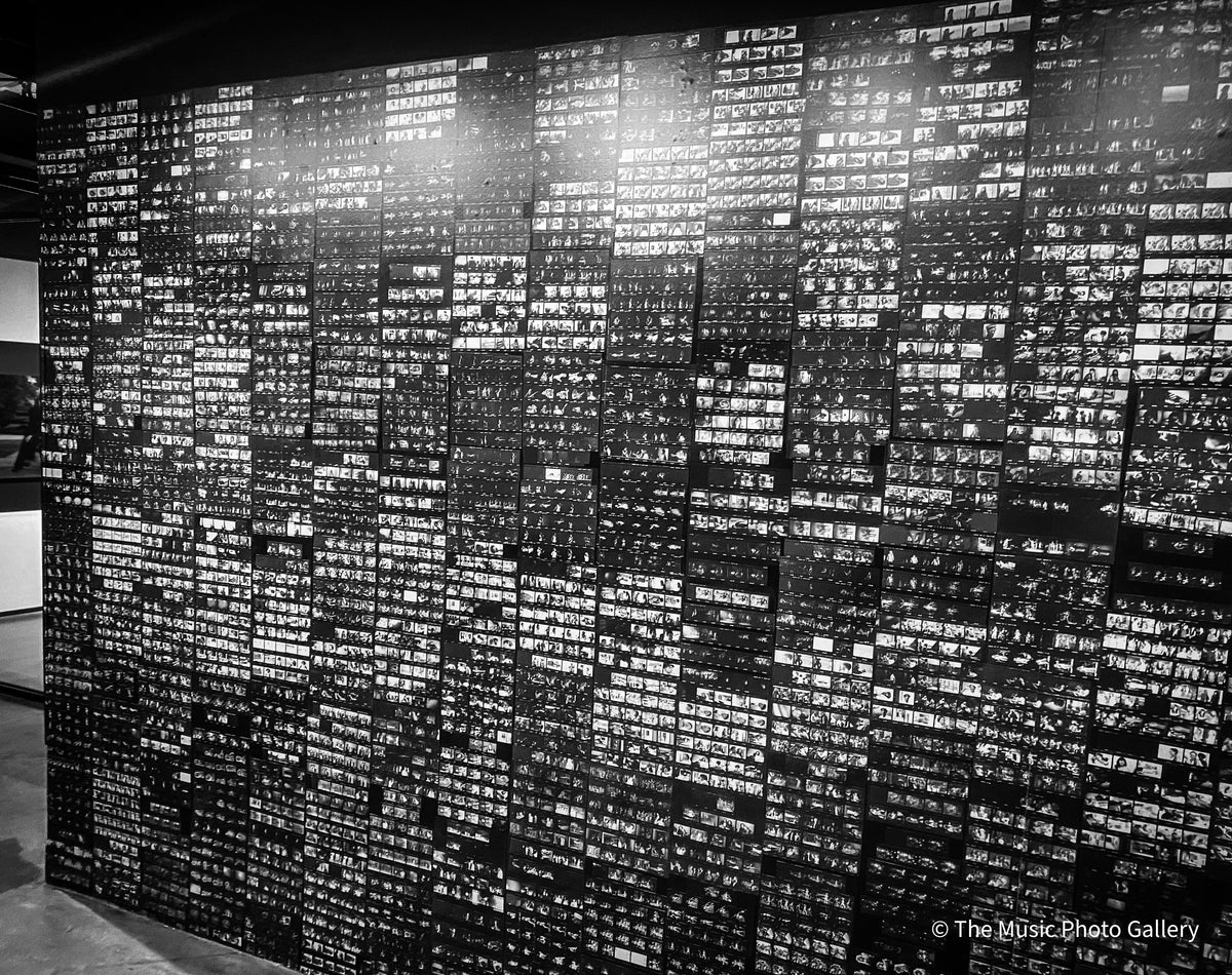 A wall covered with small black-and-white photographs in Tina Turner: A Journey to the Future at the Museum of Image and Sound (MIS), São Paulo, Brazil.