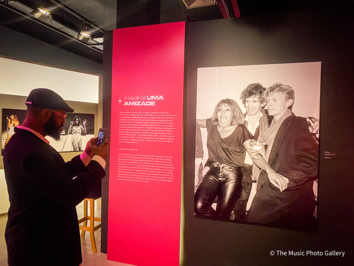 A visitor photographing The Value of a Friendship section in Tina Turner: A Journey to the Future at the Museum of Image and Sound (MIS), São Paulo, Brazil.