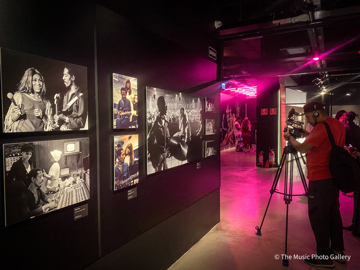 A videographer filming among the photographs in Tina Turner: A Journey to the Future at the Museum of Image and Sound (MIS), São Paulo, Brazil.