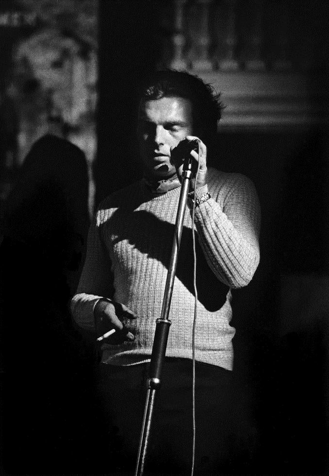 Van Morrison performing at a microphone in 1973, photographed by Barrie Wentzell.
