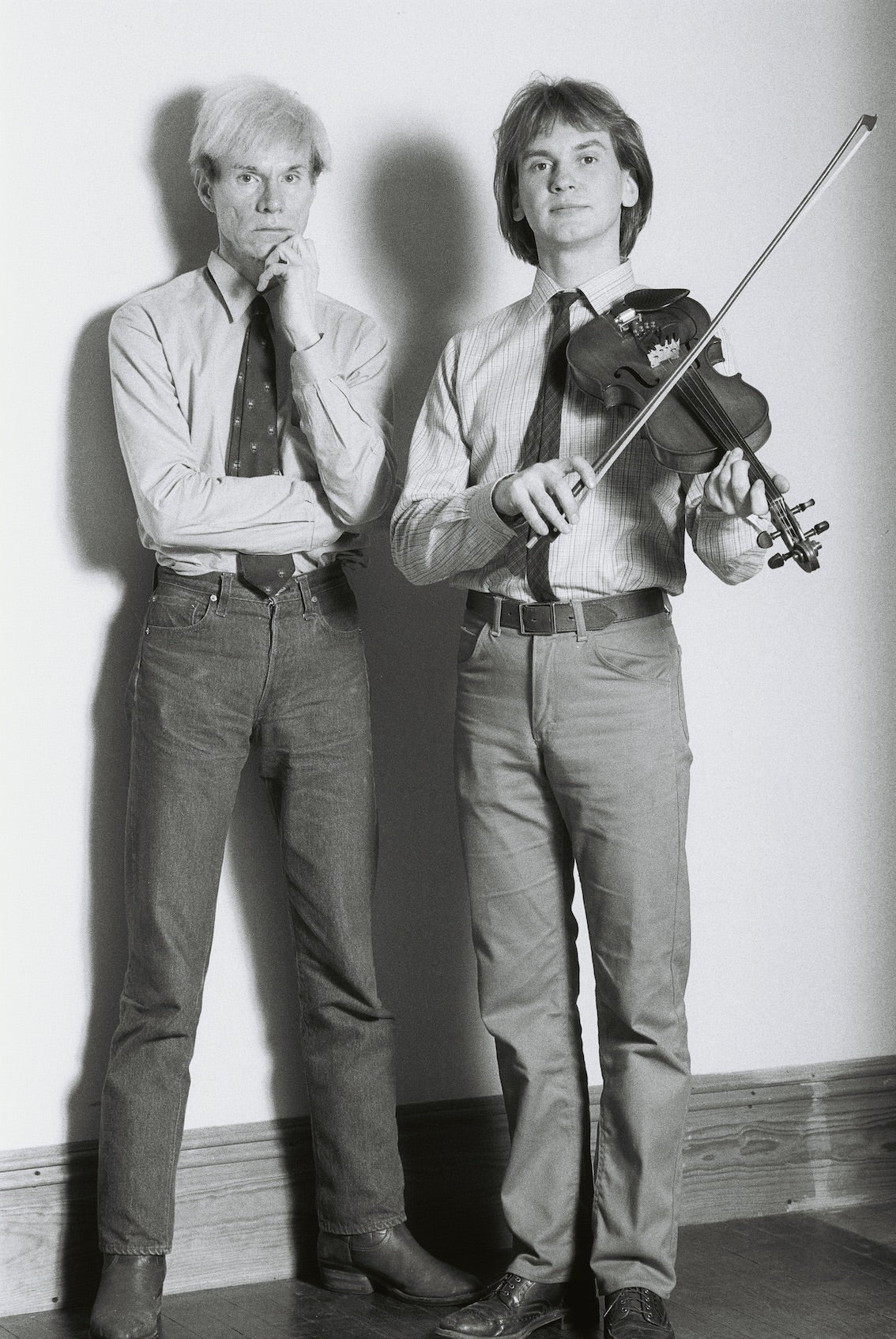 Andy Warhol and Walter Steding, studio portrait, New York City, c. 1982, photographed by George DuBose.